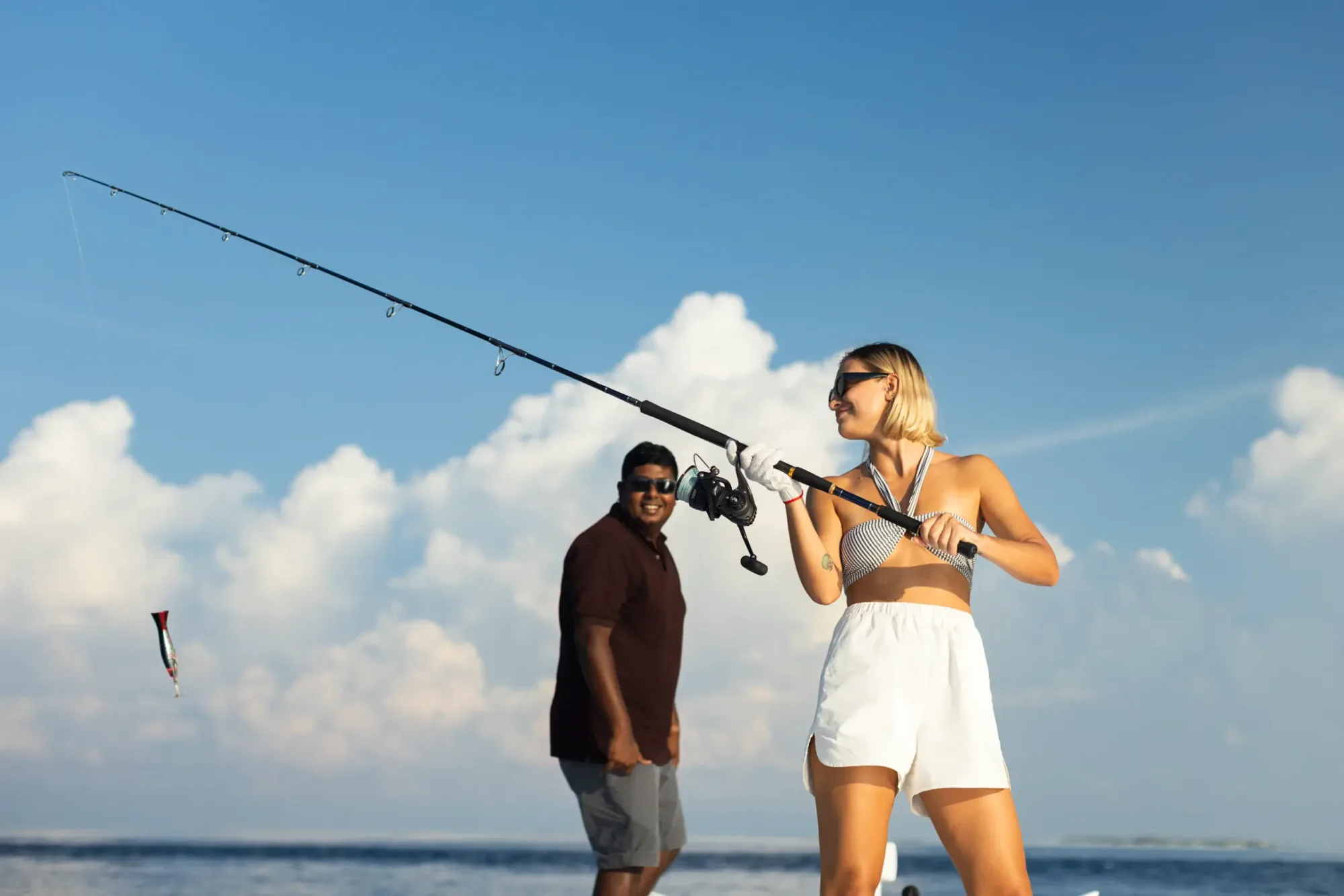A guest casting a line during a big-game fishing trip off a Maldives resort