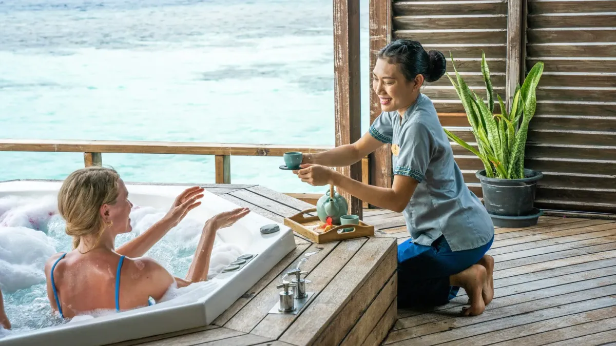 A spa treatment room open to the trees at a Maldives resort